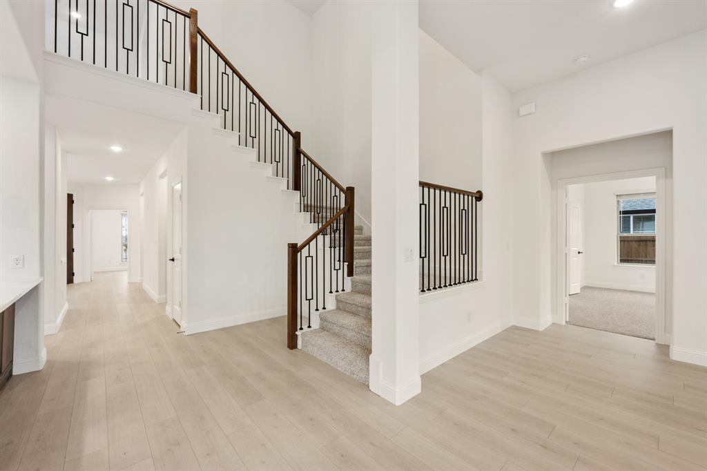 2813 Spg Vly Way Anna, TX 75409 - Photo 26 of 40 a view of a hallway with staircase