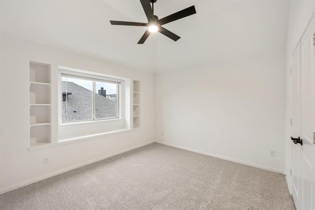 2813 Spg Vly Way Anna, TX 75409 - Photo 35 of 40 an empty room with a window and a ceiling fan
