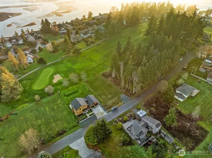an aerial view of a residential houses with outdoor space