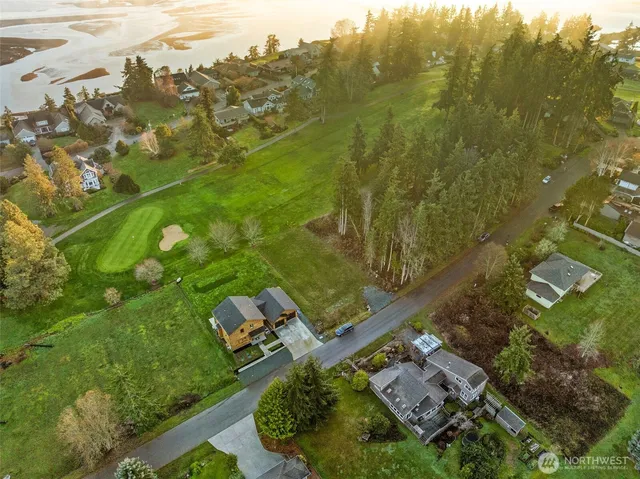 an aerial view of a residential houses with outdoor space