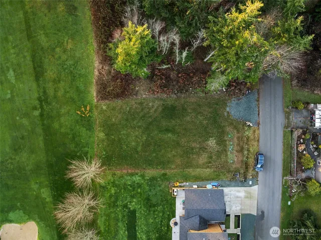 an aerial view of residential house with outdoor space