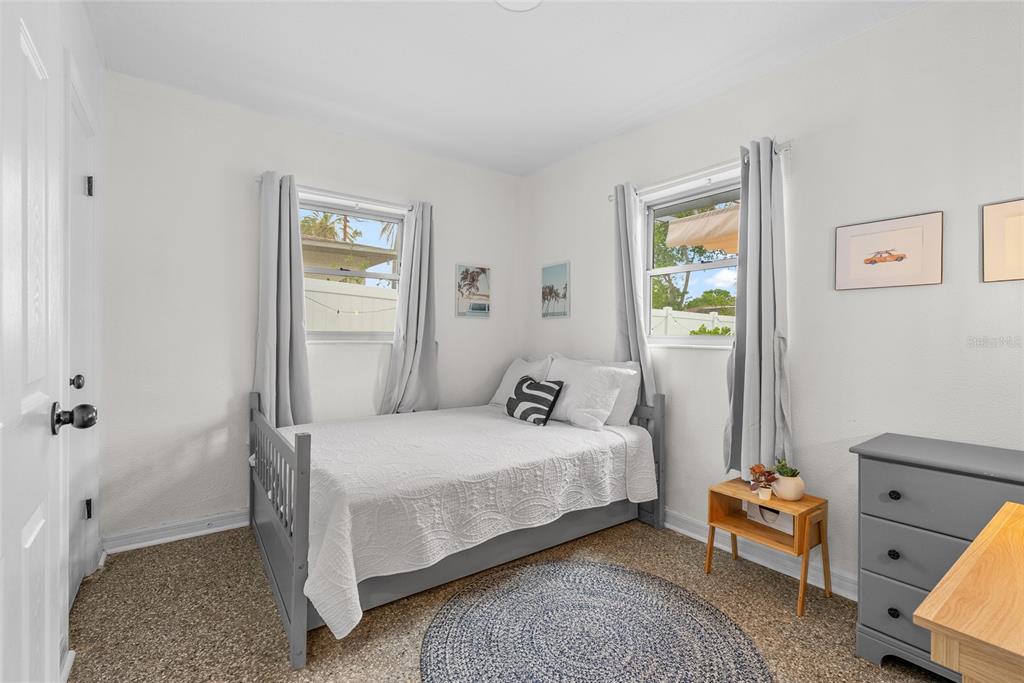 4939 100th Way North St. Petersburg, FL 33708 - Photo 21 of 43 a bedroom with a bed and a window
