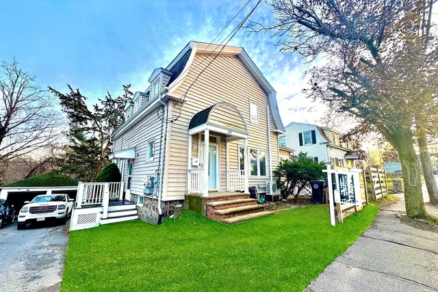 a front view of a house with a yard