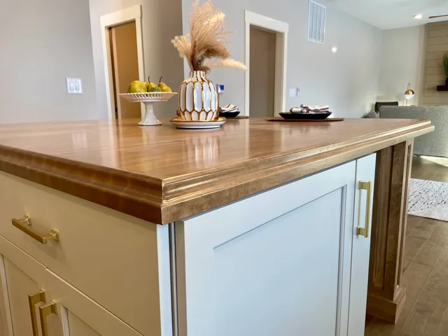 a kitchen with a sink and a refrigerator