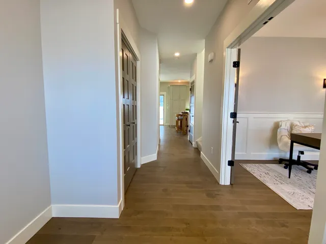 a view of a hallway with a room and a livingroom view