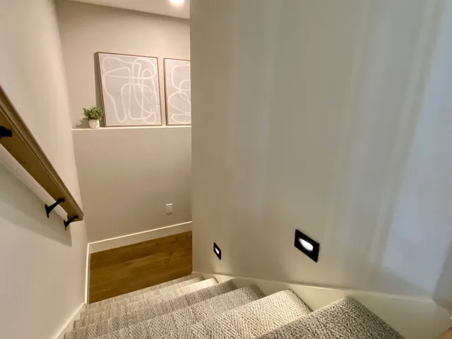 an empty room with closet and a chandelier fan