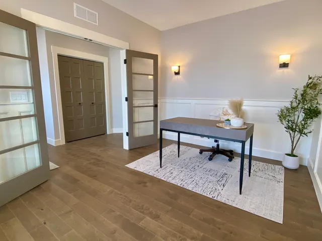 a living room with furniture and a potted plant
