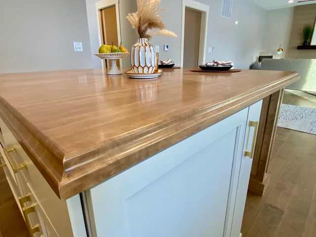 a view of a living room and kitchen
