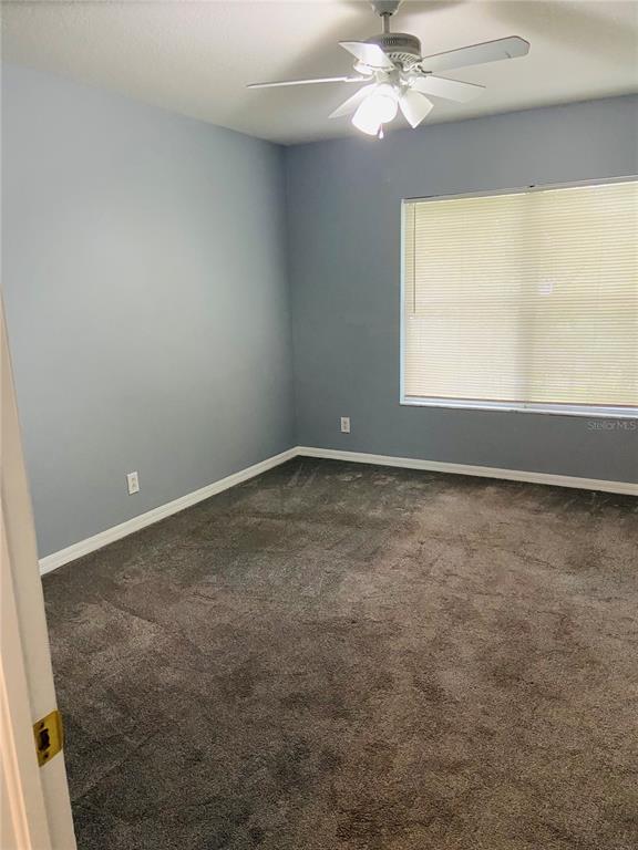 11658 Mango Ridge Boulevard Seffner, FL 33584 - Photo 11 of 20 an empty room with a window