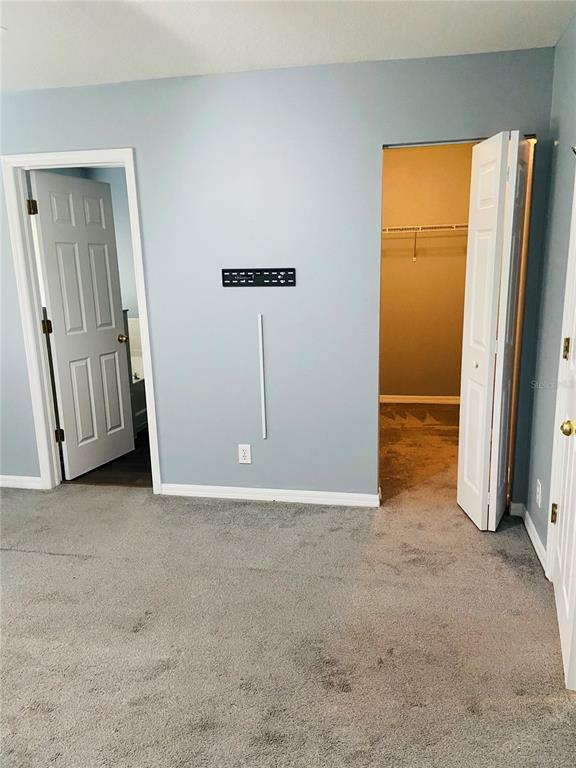 11658 Mango Ridge Boulevard Seffner, FL 33584 - Photo 12 of 20 an empty room with closet area