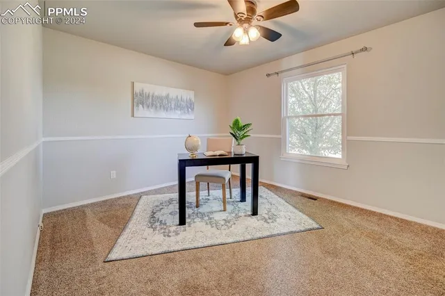 a workspace with furniture and window