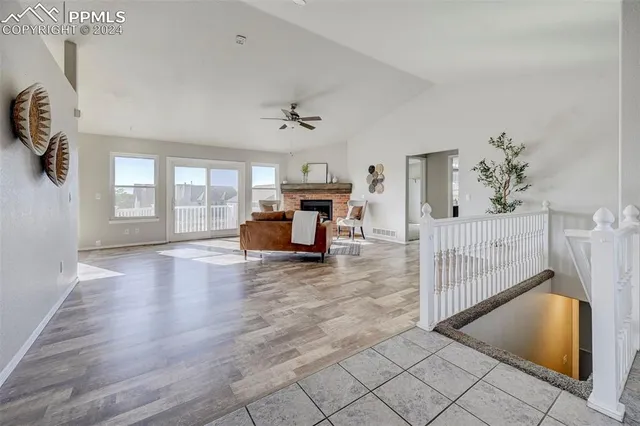 a view of livingroom with furniture wooden floor and windows