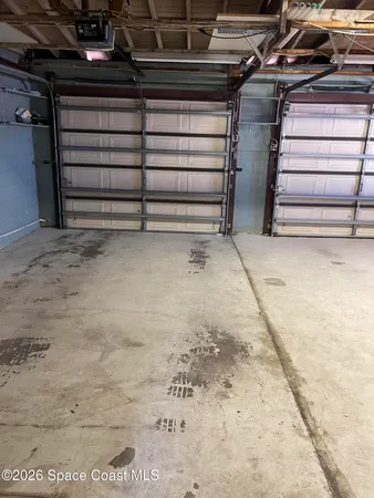 a front view of a house with a garden and patio