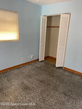 an empty room with closet