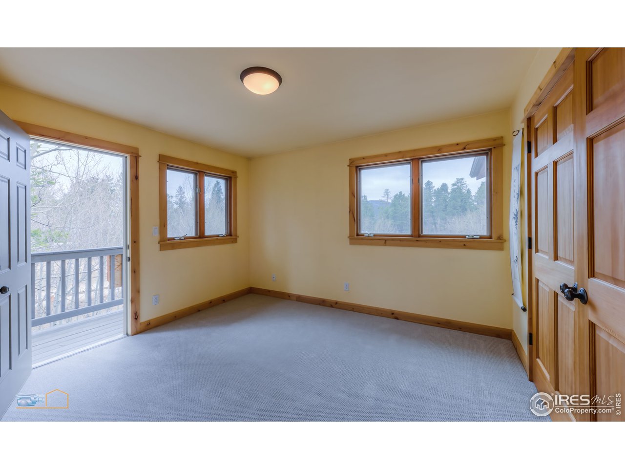 3301 Ridge Road Nederland, CO 80466 - Photo 27 of 40 a living room with a fireplace furniture and a large window