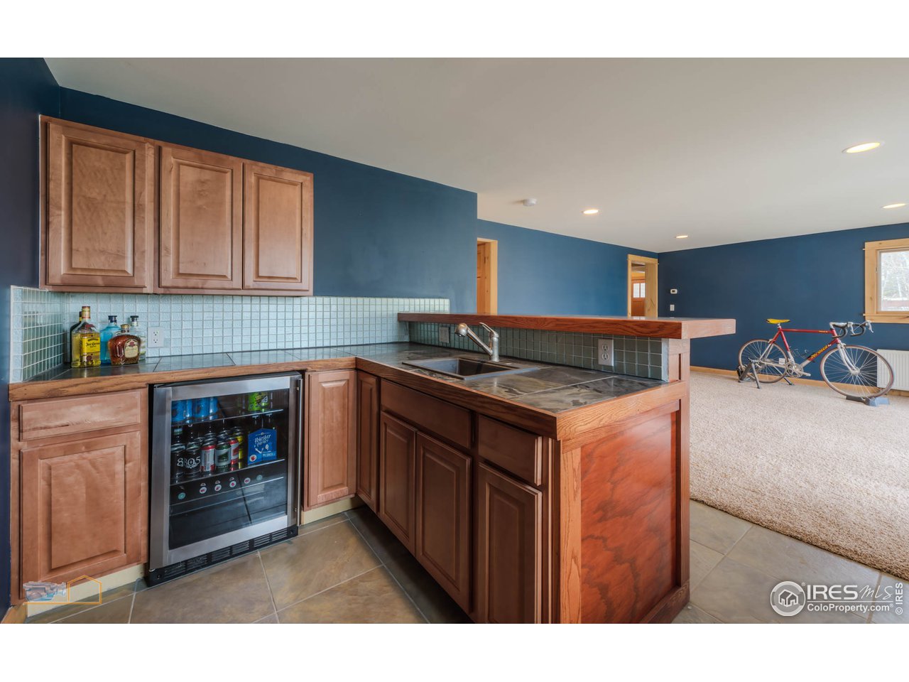 3301 Ridge Road Nederland, CO 80466 - Photo 31 of 40 a kitchen with stainless steel appliances granite countertop a stove a sink and a microwave