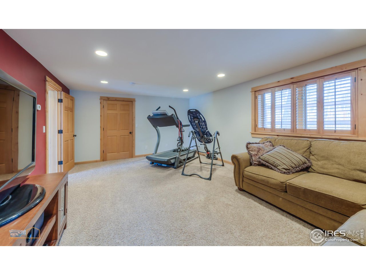3301 Ridge Road Nederland, CO 80466 - Photo 38 of 40 a living room with furniture a flat screen tv and a window