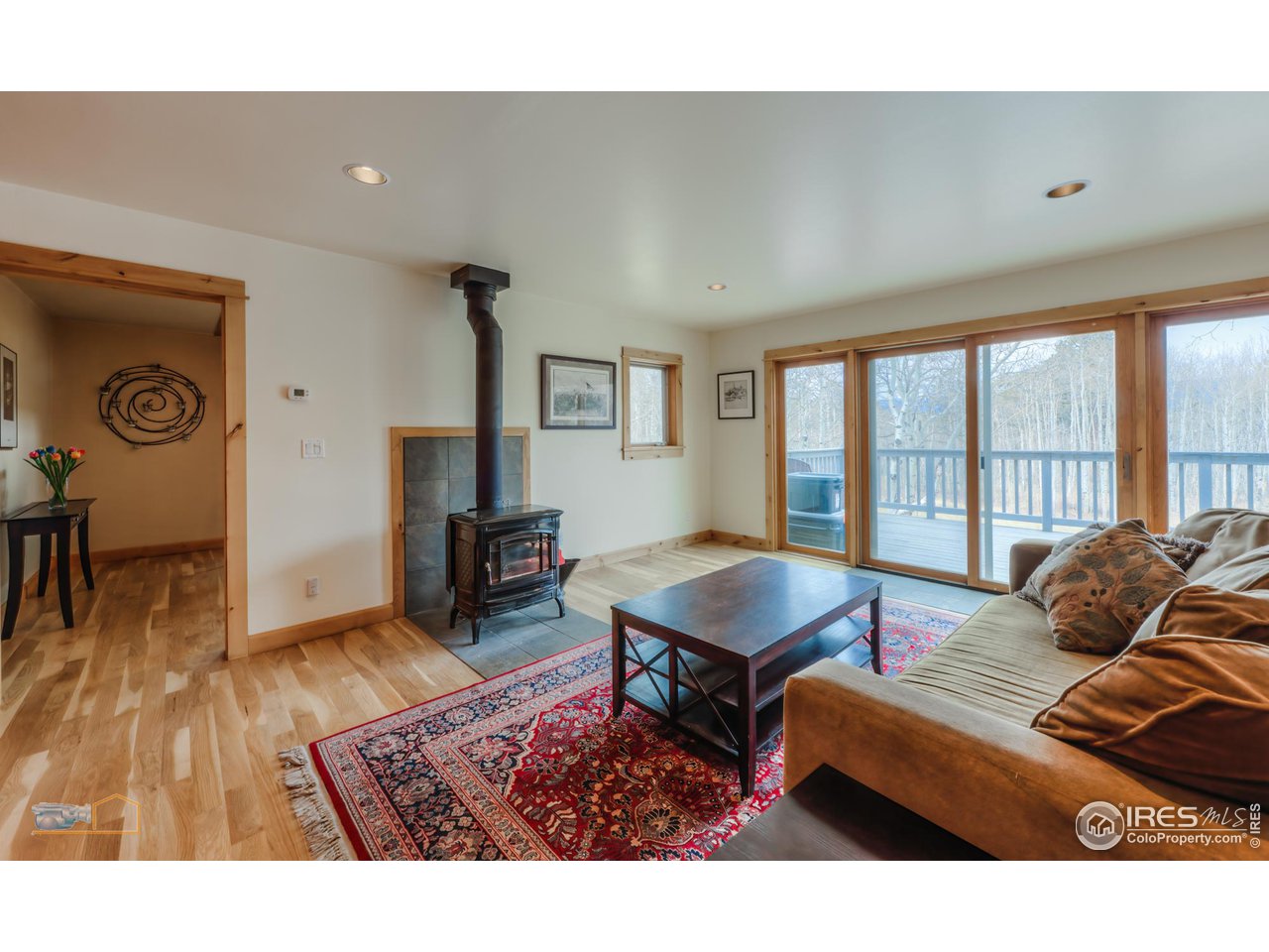 3301 Ridge Road Nederland, CO 80466 - Photo 7 of 40 a bedroom with furniture and a wooden floor