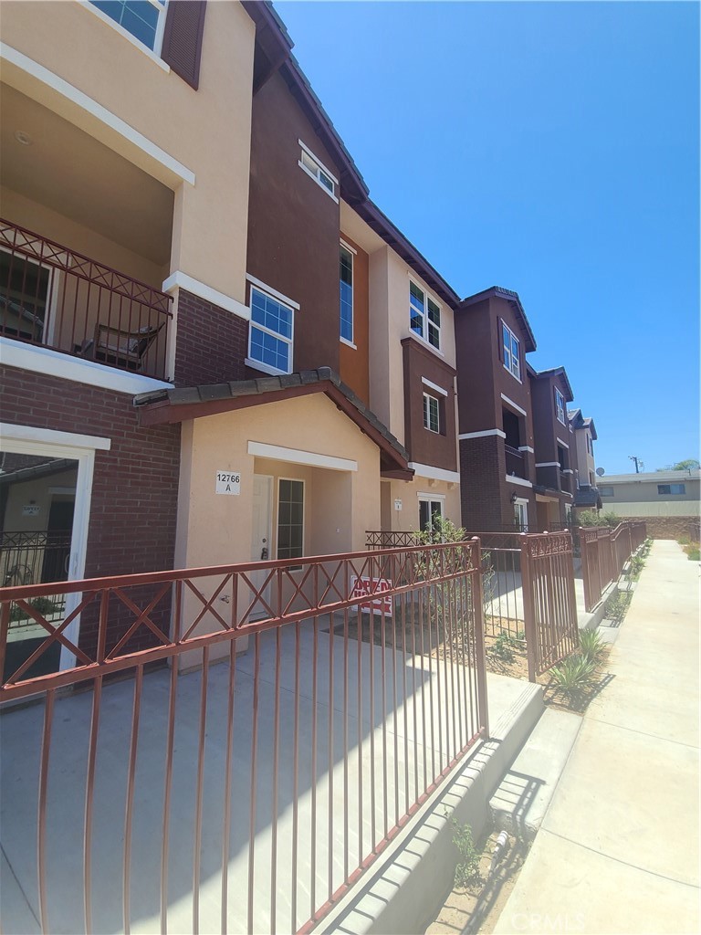 12766 Torch Street, Unit B Baldwin Park, CA 91706 - Photo 2 of 13 a view of a building from a balcony