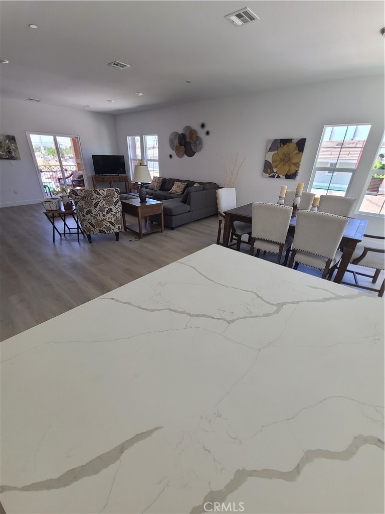 12766 Torch Street, Unit B Baldwin Park, CA 91706 - Photo 10 of 13 a bedroom with furniture and a chandelier