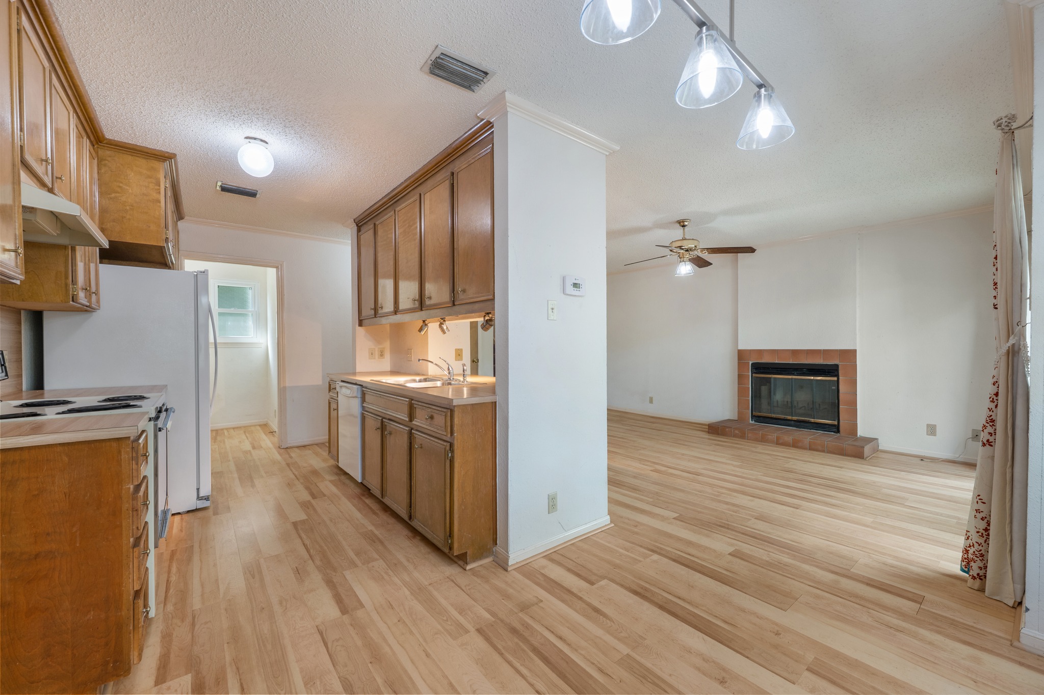 3845 Ranch Road 2222, Unit 19 Austin, TX 78731 - Photo 17 of 38 a kitchen with stainless steel appliances a stove a refrigerator and a microwave