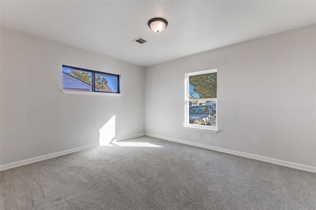 3719 Dutton Drive Dallas, TX 75211 - Photo 13 of 24 a view of an empty room with a window
