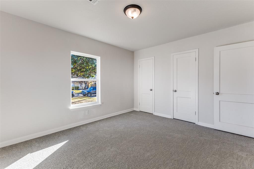 3719 Dutton Drive Dallas, TX 75211 - Photo 14 of 24 an empty room with windows