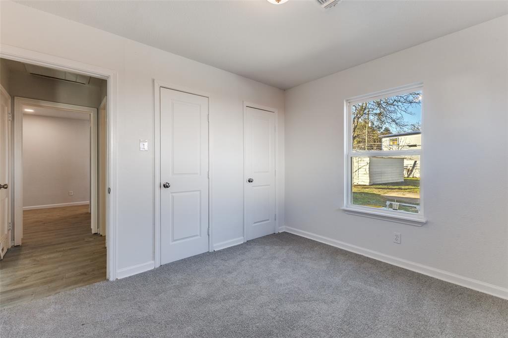 3719 Dutton Drive Dallas, TX 75211 - Photo 16 of 24 a view of an empty room with a window and closet area