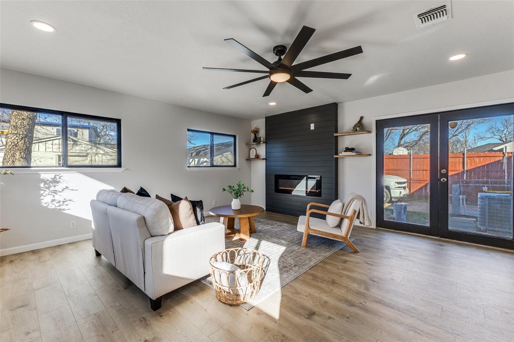 3719 Dutton Drive Dallas, TX 75211 - Photo 6 of 24 a living room with furniture and a fireplace