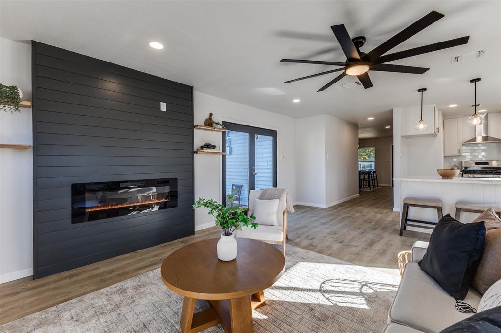 3719 Dutton Drive Dallas, TX 75211 - Photo 7 of 24 a living room with furniture and a fireplace