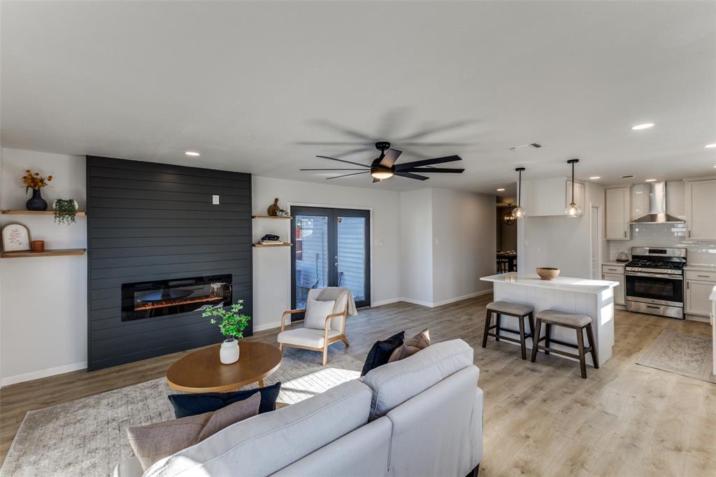 3719 Dutton Drive Dallas, TX 75211 - Photo 9 of 24 a living room with furniture and a fireplace