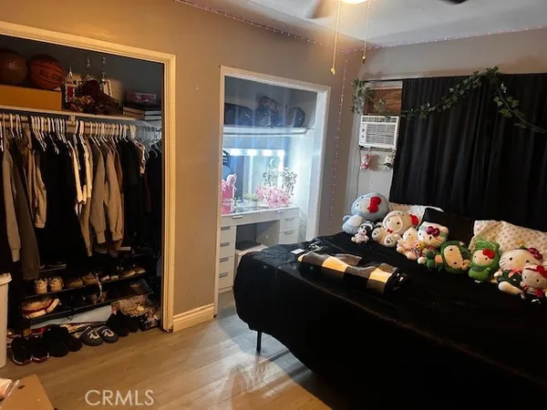 a bed room with two beds and a window