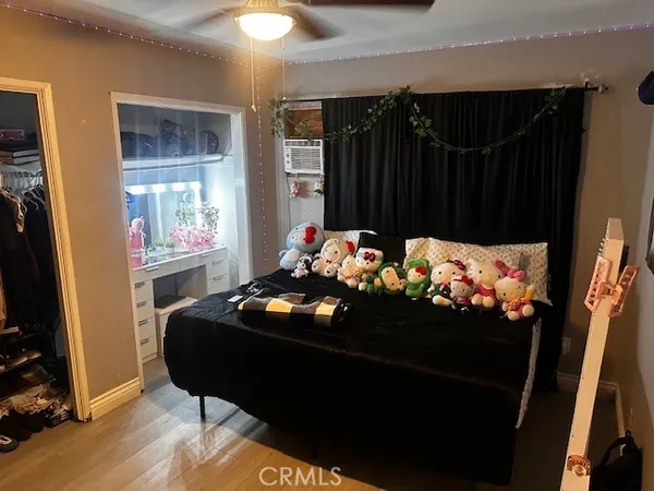 a room with bed and a flat screen tv