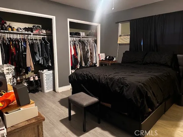 a bedroom with a bed and a closet