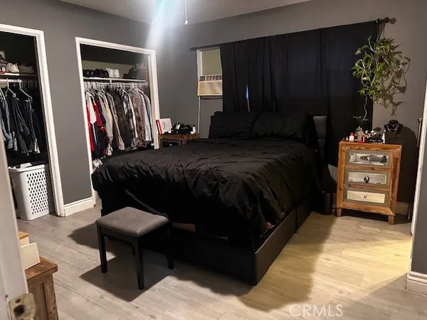a bedroom with a bed and a closet