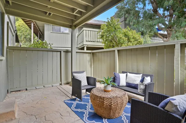 a outdoor living space with furniture and a potted plant