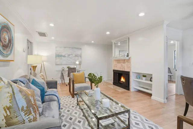 a living room with furniture a fireplace and a fireplace