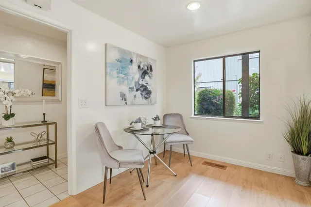 a dining room with furniture and window