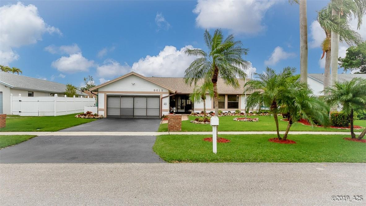 9612 Ohio Place Boca Raton, FL 33434 - Photo 3 of 26 a front view of house with yard and green space
