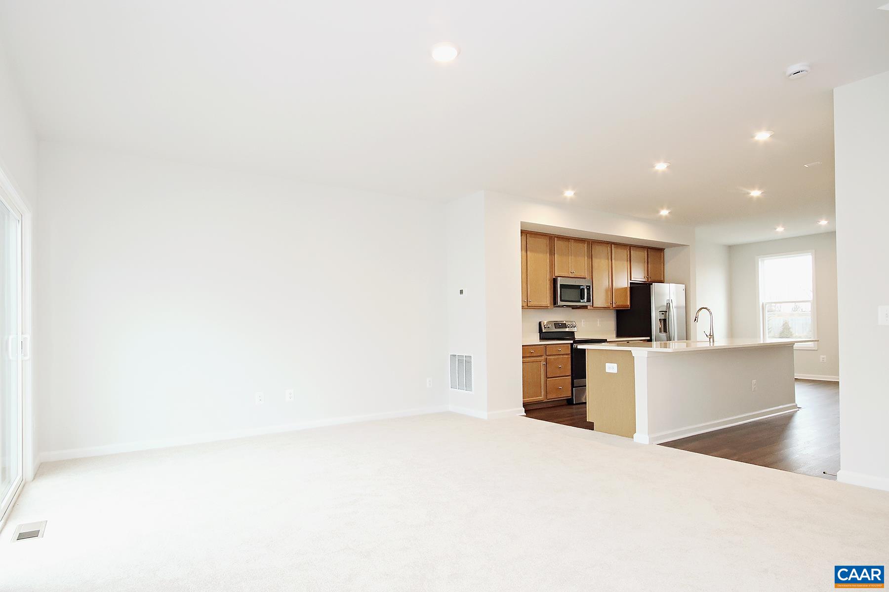 5997 McComb Street Crozet, VA 22932 - Photo 9 of 27 a large kitchen with a sink and cabinets