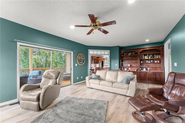 a bedroom with furniture and a wooden floor