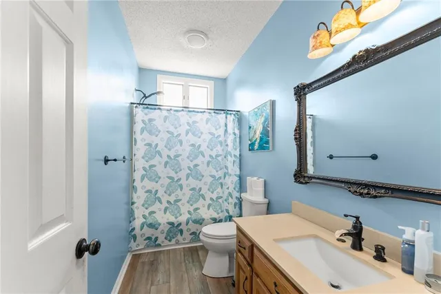 a living room with furniture and floor to ceiling windows