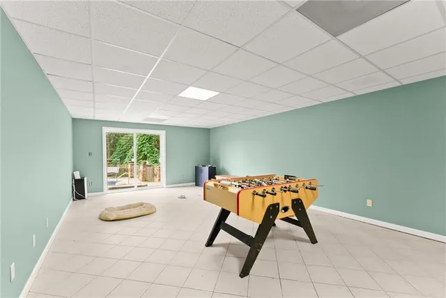 a view of a lush green field with lots of bushes