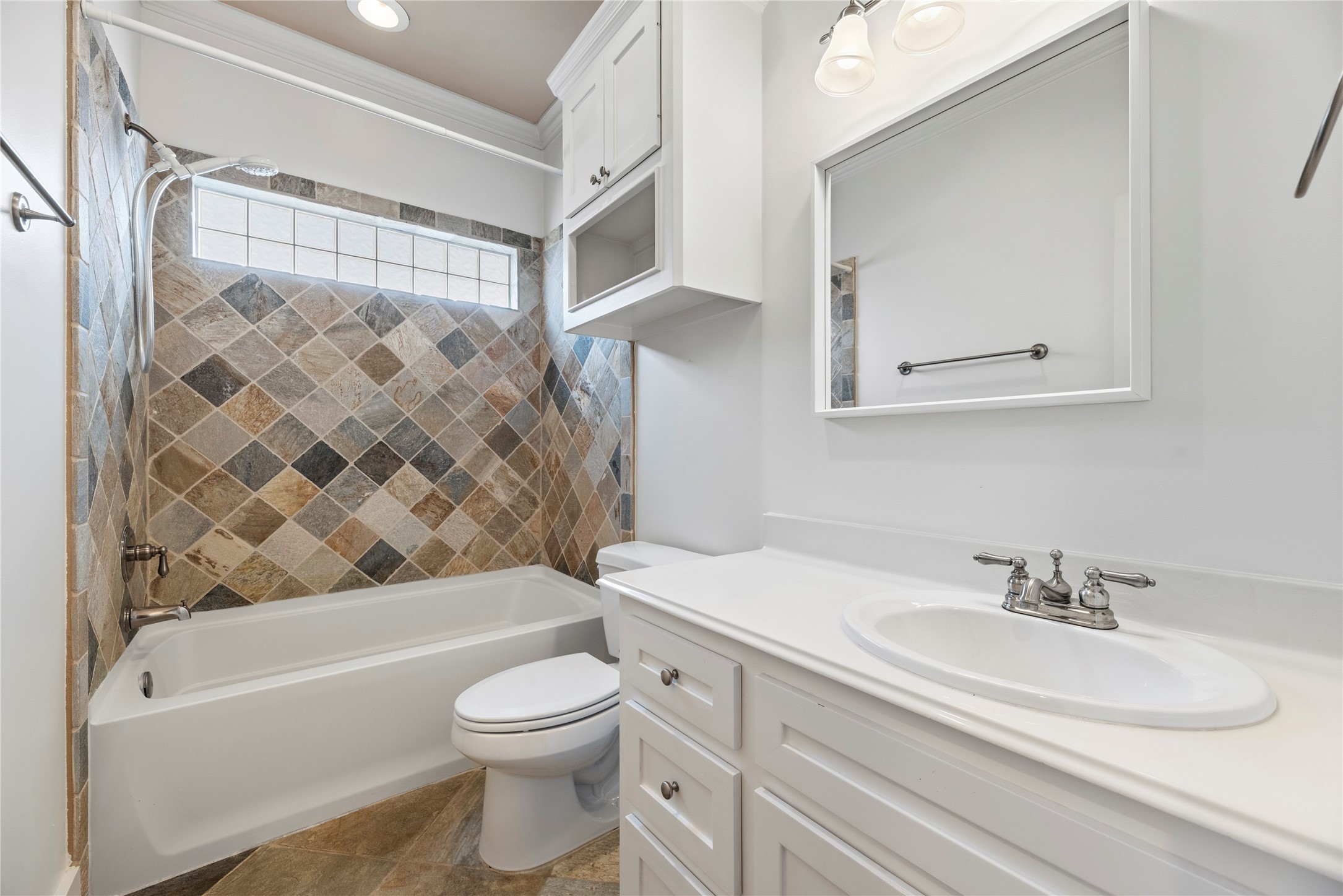 1505 Prince Street Houston, TX 77008 - Photo 26 of 39 Secondary bath features a tub/shower combo, fun tile work, counter space, and ample storage.