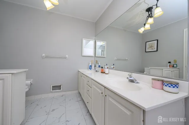 a view of a bathroom sink and a mirror