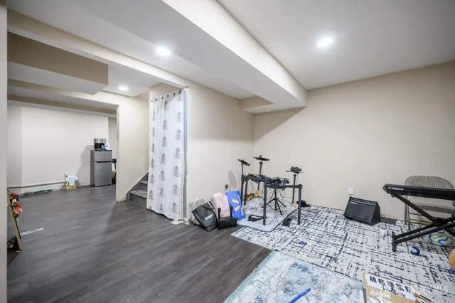 a view of a room with furniture and gym equipment