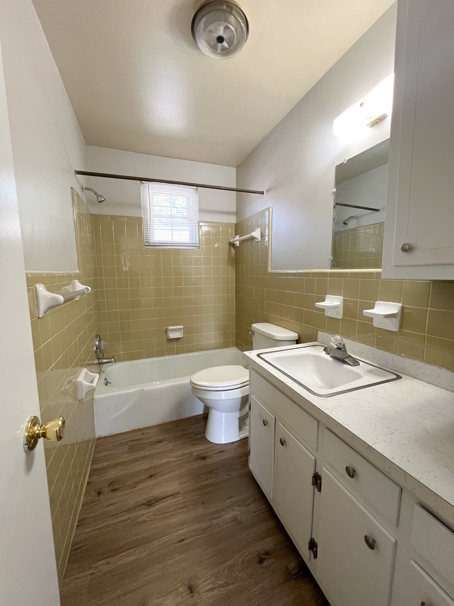 701 Power Street, Unit 1 Clarksville, TN 37042 - Photo 8 of 10 a bathroom with a double vanity sink toilet and shower