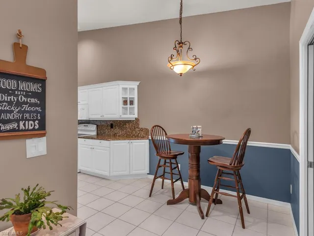 a kitchen with a sink cabinets and appliances