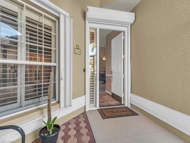 a view of a backyard with sitting area