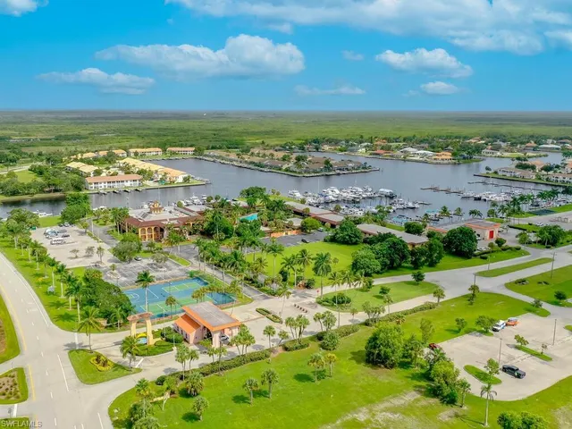 an aerial view of a city with lawn chairs